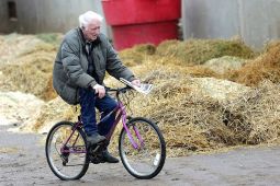 Red riding his bike in the backstretch