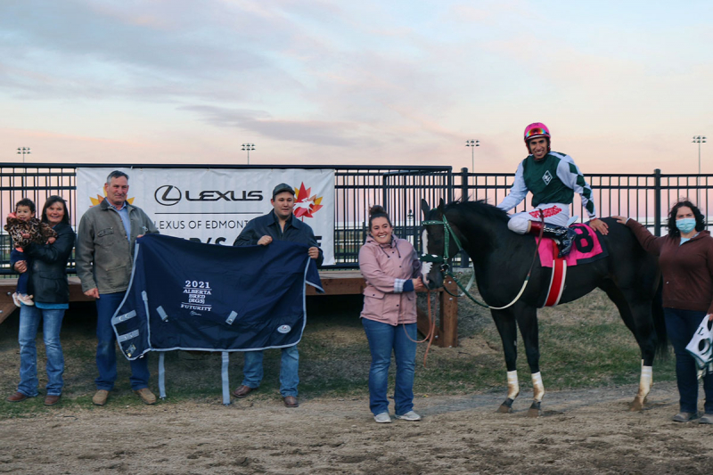 Destello De Luna in the winner's circle with the Leech family and Ricardo Moreno